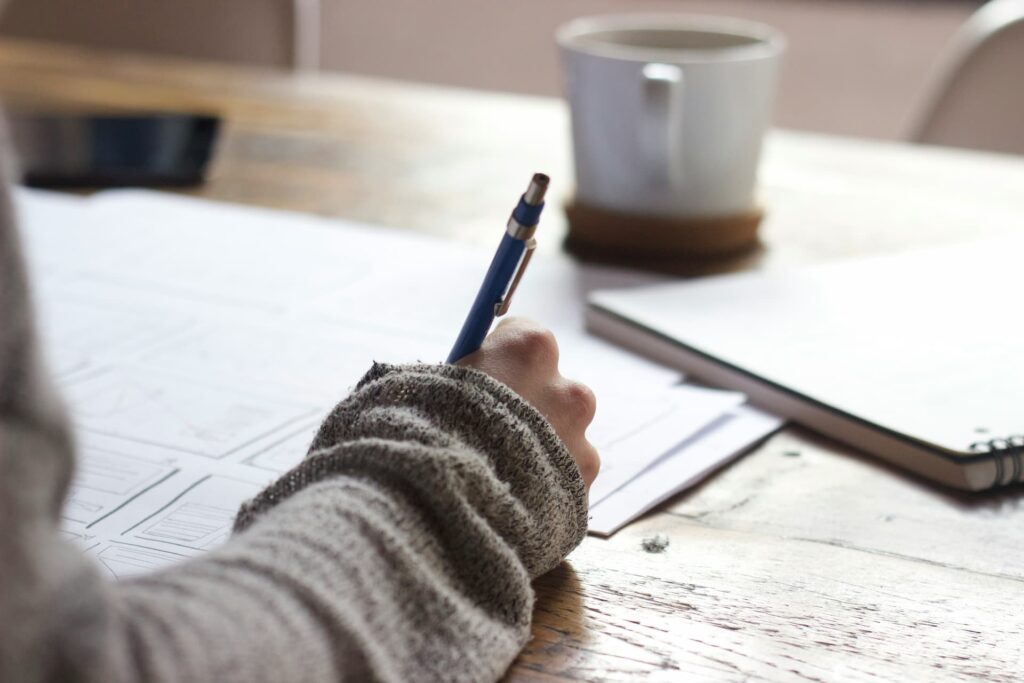 hand writing notes for a new blog
